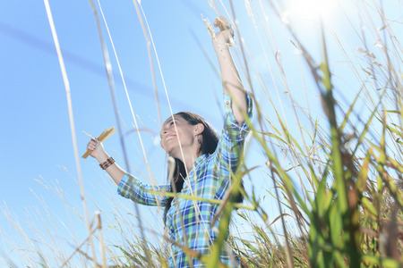A woman holding spaghetti over the sky