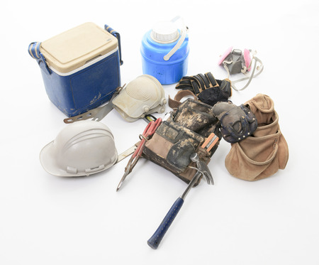 construction employee tools over white background