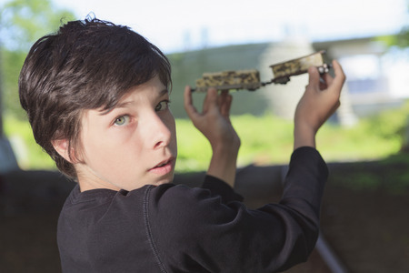 A young boy posing at the railroadの写真素材
