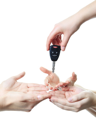 A hand give key to other person. if you drink don't drive