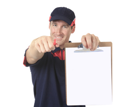 Delivery person delivering packages holding clipboard and package