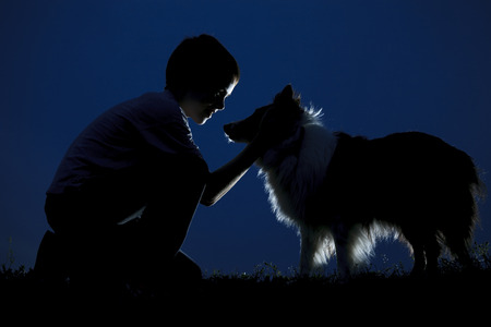 Young family happy play on the coast of background sunriseの写真素材