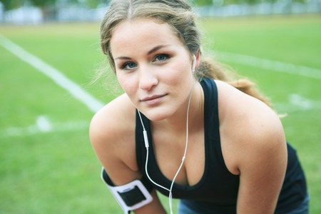 A Runner woman jogging on a field outdoor shotの写真素材