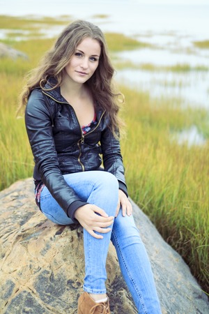 A Fashion woman outdoor with leather coatの写真素材