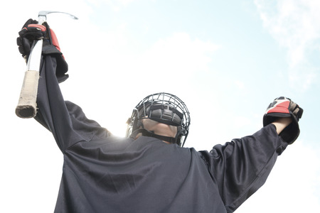 A Portrait of hockey ball player with hockey stickの写真素材