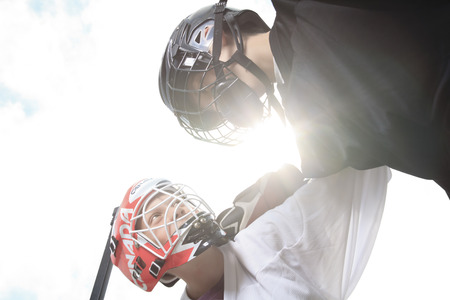 A Portrait of hockey ball player with hockey stickの写真素材