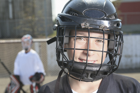 A Portrait of hockey ball player with hockey stickの写真素材