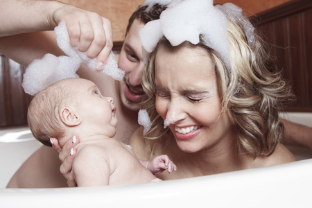 A little baby girl taking a bath
