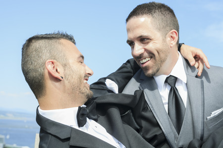 Portrait of a loving gay male couple on their wedding day.の写真素材