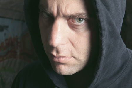 Smoking Criminal Waiting for a Man Behind a Cornerの写真素材