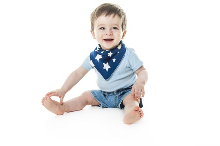 A baby boy sit the a studio white backgroundの写真素材