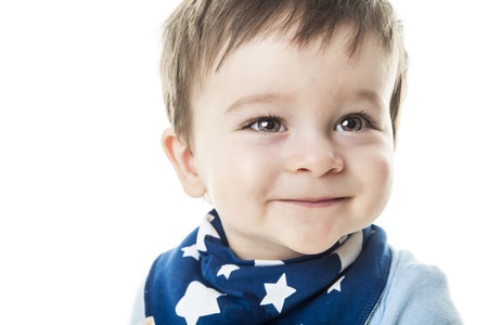 A baby boy sit the a studio white backgroundの写真素材