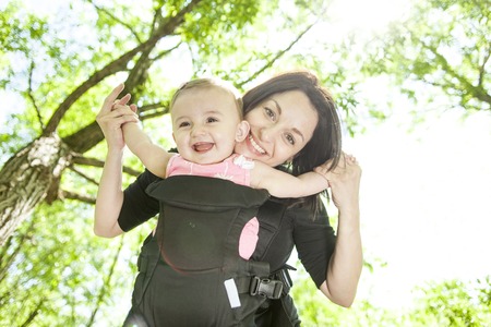 A Mother and daughter haviing good time in forest