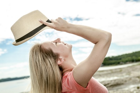 A girl portrait on the side of a seaの写真素材