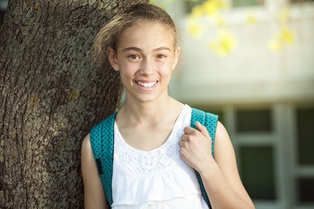 A Portrait of a student outside close to a schoolの写真素材
