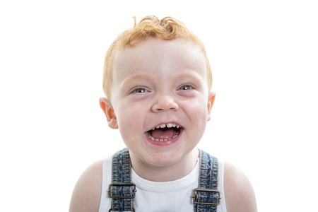 A redhead baby boy portrait over a isolated white background