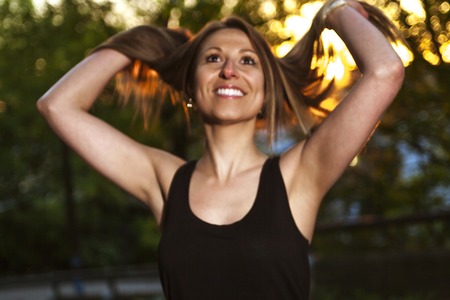 A Young beautiful woman portrait at the sunsetの写真素材