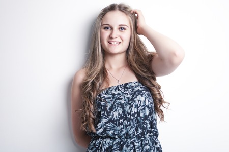 A fashion look of beautiful young teen over white backgroundの写真素材