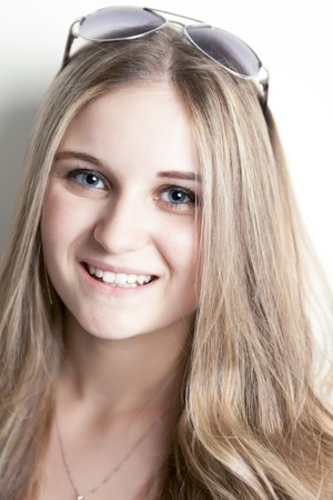 A fashion look of beautiful young teen over white backgroundの写真素材