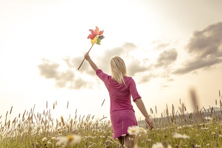 A Photo of pretty blonde woman on a fieldの写真素材