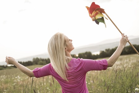 A Photo of pretty blonde woman on a field