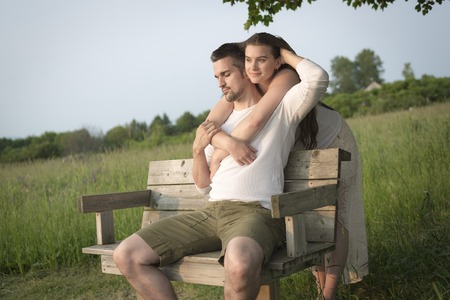 A Young couple in love outdoor at the sunsetの写真素材