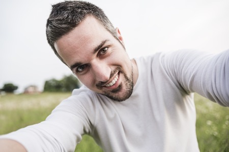 A Happy young man in a fieldの写真素材