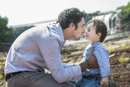An happy joyful father having fun with is childの写真素材