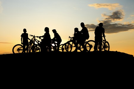 A Gang doing Bike with a yellow sunsetの写真素材