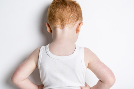 A redhead baby boy portrait over a isolated white backgroundの写真素材