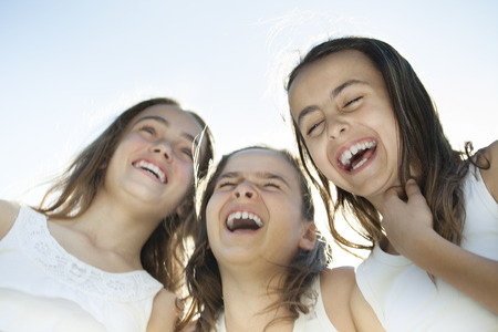 A girl with roller on the foot to do exerciseの写真素材