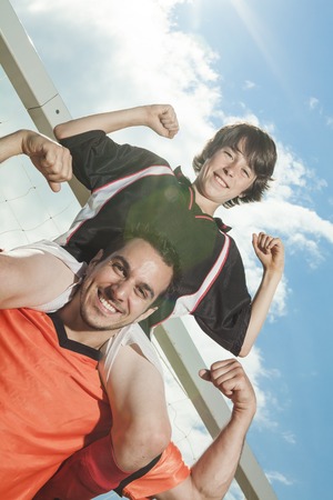 Dad and boy shoulder stroung