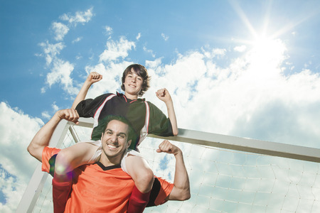 Dad and boy shoulder stroungの写真素材