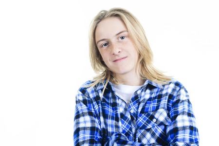 Close up portrait of young teenager in white, isolated on whiteの写真素材
