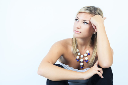 A Beautiful blonde woman posing standing facing the camera.の写真素材