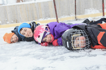 A portrait of happy child in a row in winter Seasonの写真素材