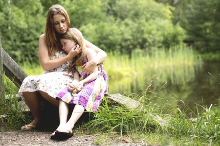A Mother and daughter in forest together