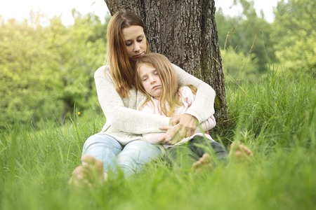 A Mother and daughter in forest togetherの写真素材
