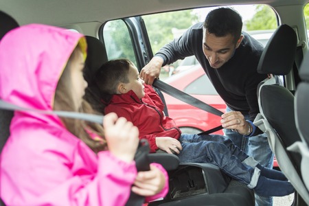 A Father worried about her children's safety in a carの写真素材