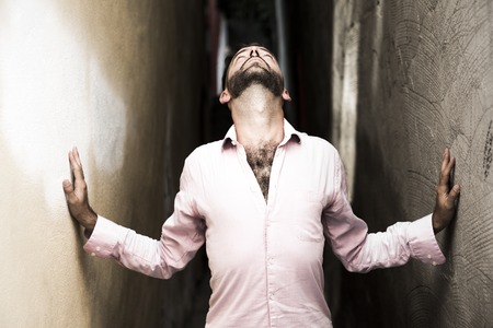 A Portrait of young, depressed man in painの写真素材