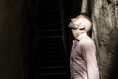 A Portrait of young, depressed man in painの写真素材