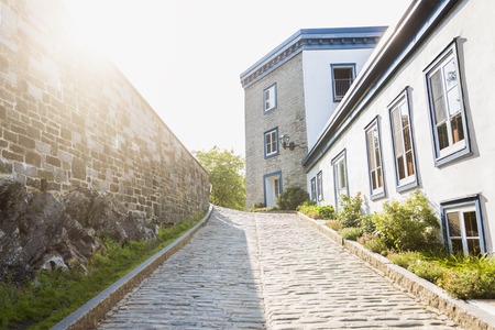 A Street of old Quebec city with sun on the left side