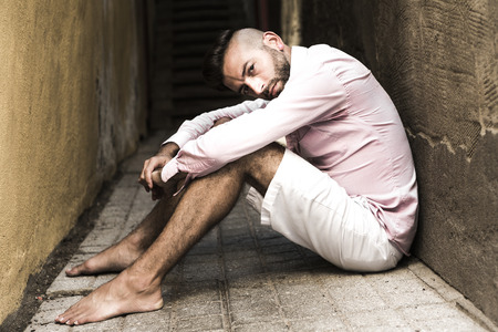 A Portrait of young, depressed man in painの写真素材