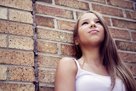 An urban girl in the street of a cityの写真素材