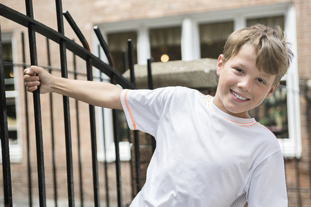 An urban boy in the street of a cityの写真素材