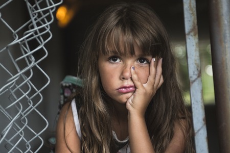 A eight years old school girl close to the schoolyardsの写真素材