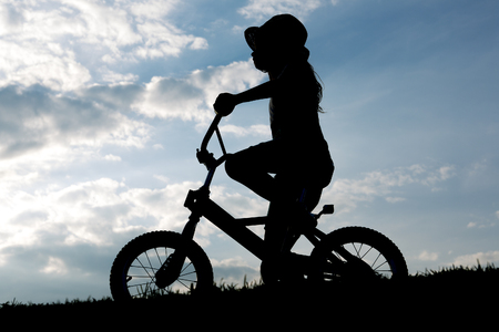A Silhouette of a young child on backlitの写真素材