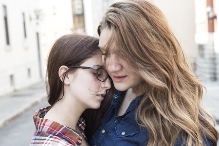 A Woman comforting a sad caucasian girlの写真素材