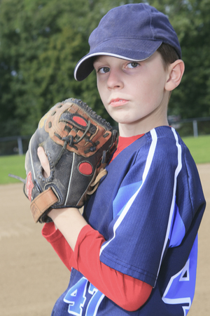 A child baseball pitchen on the fieldの写真素材