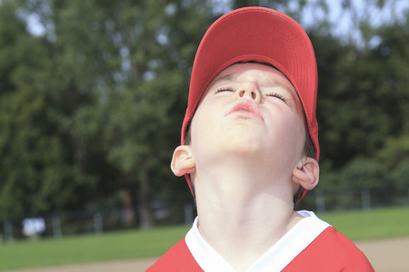 A children baseball player don't want to playの写真素材